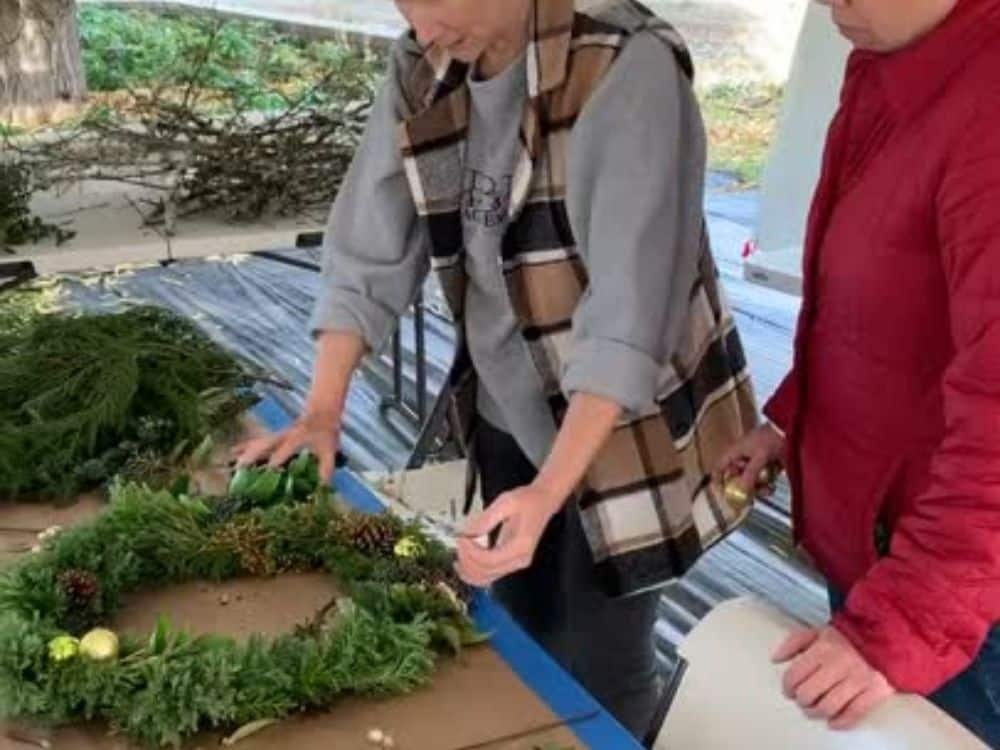Making a wreath during a holiday greens workshop at HvH Specialty Growers in Fairfield, California
