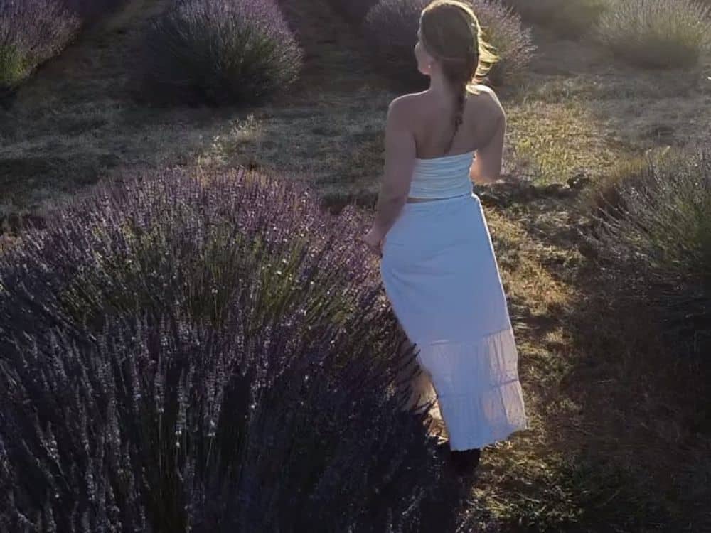 Woman standing in the lavender field at HvH Specialty Growers in Fairfield, California