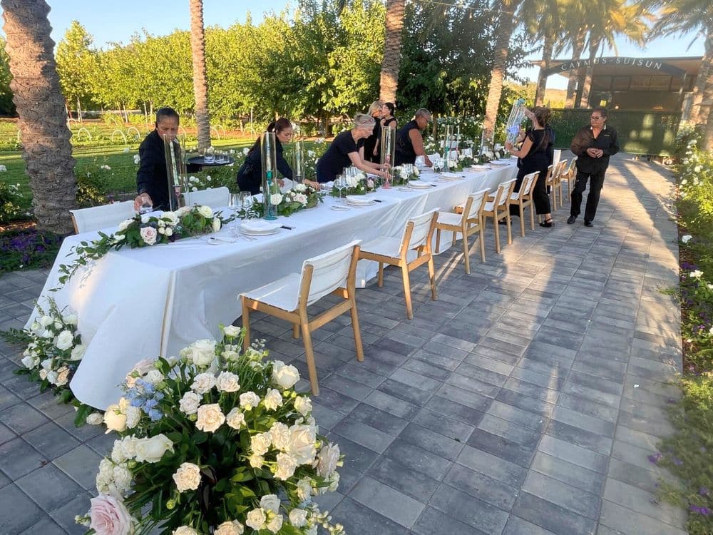 Setting up for an outdoor wedding at HvH Specialty Growers in Fairfield, California