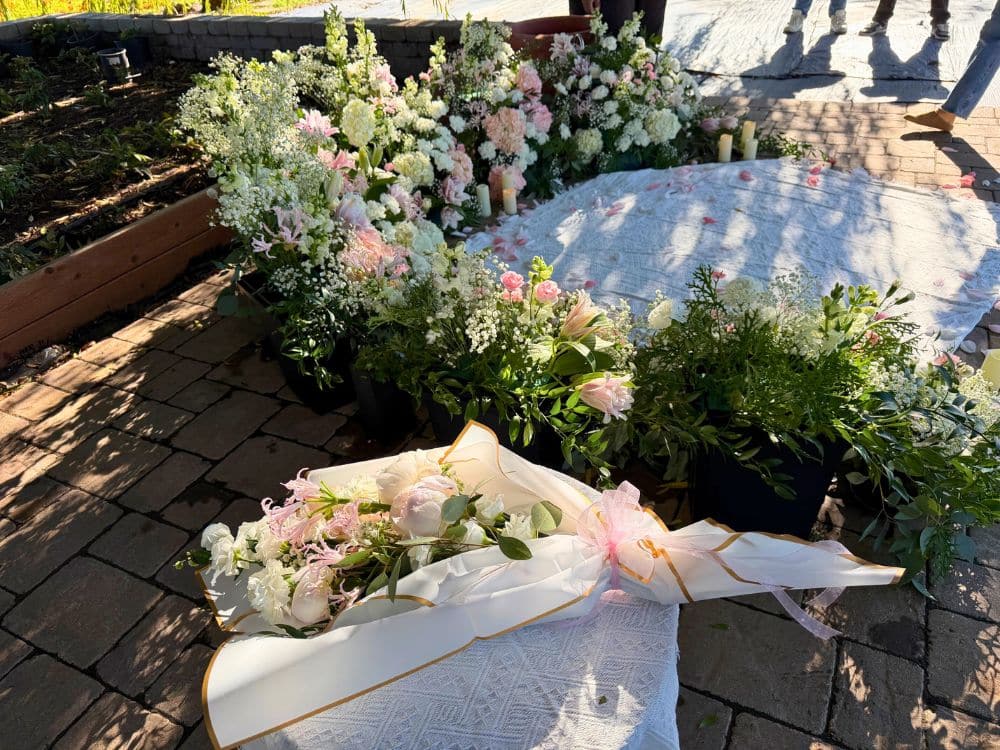 Custom floral arrangement and setting for a proposal under the Weeping Willow at HvH Specialty Growers in Fairfield, California